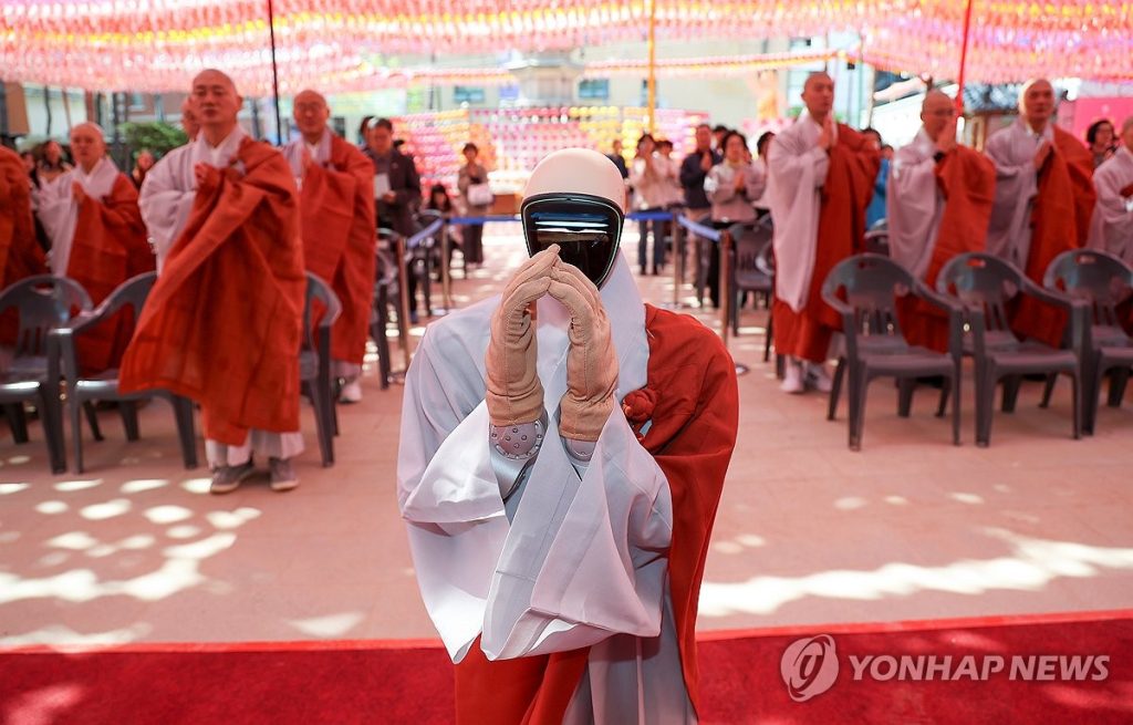 Buddhist Sect Welcomes Humanoid Robot Gabi: Precept Ceremony